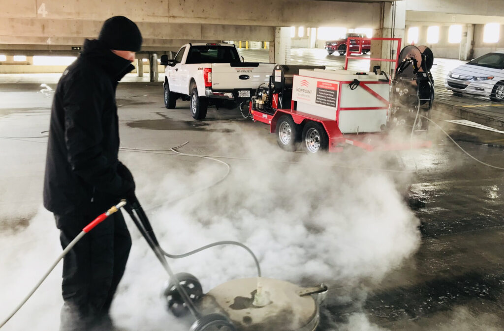 Pressure Washer Cleaning in Parking Garage